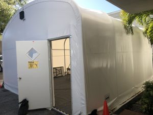enclosed fabric structure with an open entry door 