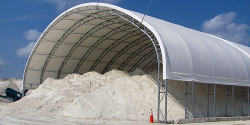mounds of minerals under a fabric structure